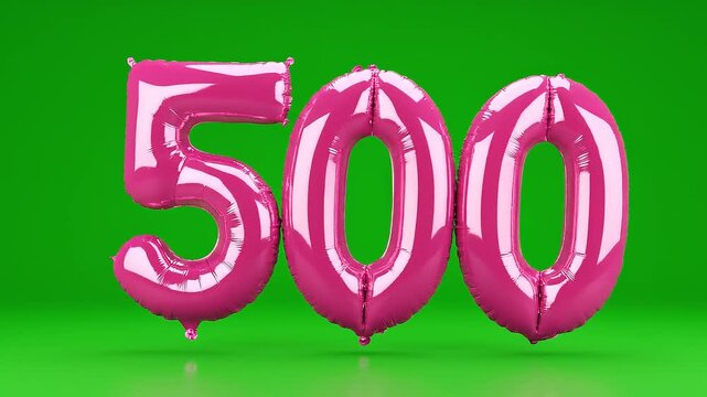 Pink foil balloon number 500 floating on green screen