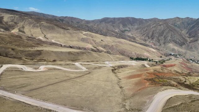 Chuckurchak, Kyrgyzstan December 16, 2025: Picturesque village with mountains natural beauty in Central Asia.