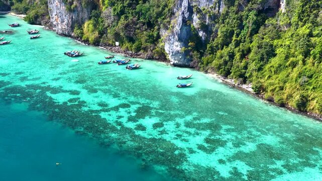 Aerial View of Longtail Boats in Turquoise Water at Phi Phi Islands
