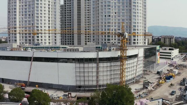 Construction site with cranes and skyscrapers