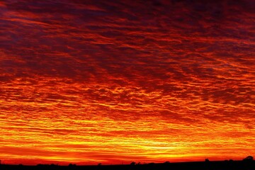 Fiery orange and red sunset clouds