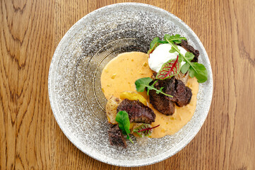 grilled roast meat with a side dish on a plate