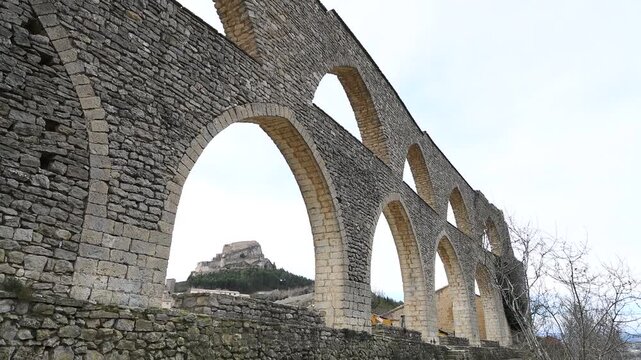 Medieval Gothic Aqueduct in Morella with Castle Background