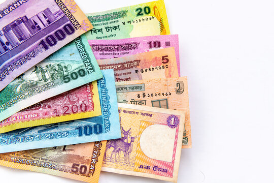 A close up of the Bangladesh currency isolated on white, showing the entire range of bank notes from 1 to 1000 Taka.