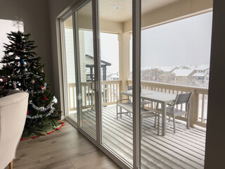Indoor holiday room with snowy balcony view