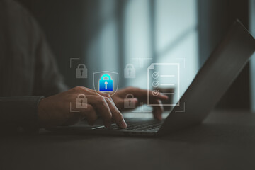 Typing on laptop keyboard with digital lock icons illustrating cybersecurity and data protection