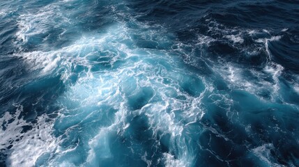 A deep blue ocean with soft foam