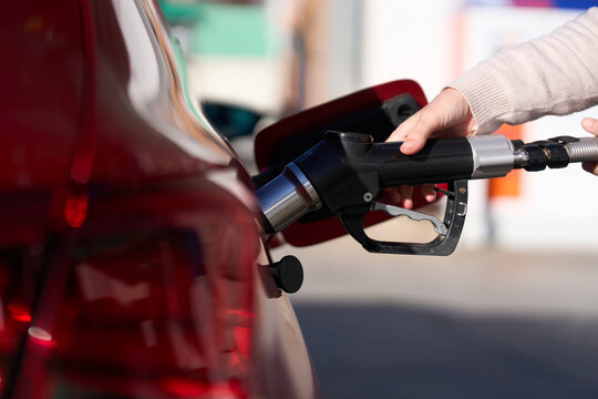 Hand refueling vehicle with compressed natural gas at station