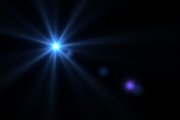 Fototapeta premium Blue optical lens flare light effect with starburst on black background.