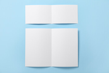 Fototapeta premium Blank brochures on blue background