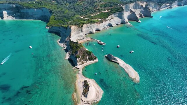 Breathtaking Aerial View of the Famous Cape Drastis on Corfu Island Greece with White Sedimentary Rock Peninsulas Extending into the Emerald Green Sea during Summer Vacation