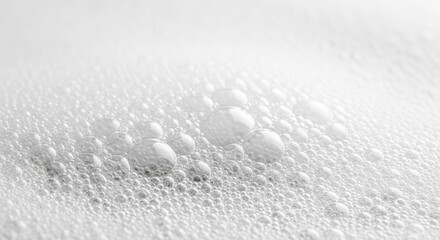 Dramatic ocean wave crashing with white foam and mist in black and white minimalist seascape