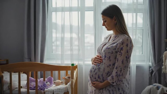 Woman standing near crib with baby inside