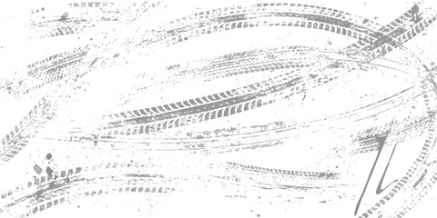 A chaotic arrangement of gray tire tracks and tread marks on a white background creating a distressed texture pattern. © md