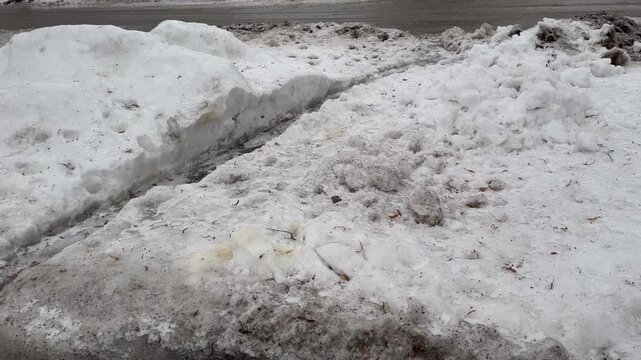 The road was covered with ice after the rain in the frost.
