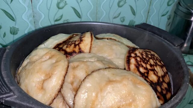 Freshly cook of Roti Berre a traditional Bugis Indonesian cake made of rice flour with ripe banana.