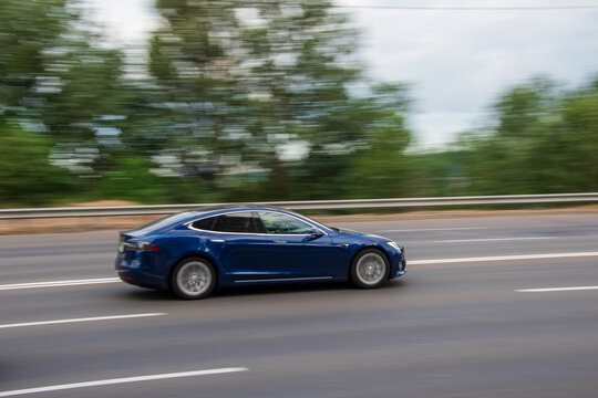 Ukraine, Kyiv - 29 Jule 2021: Blue TESLA Model S car moving on the street.