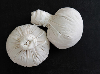 Herbal compress ball and Thai herbs for aromatherapy massage, Thai massage, traditional massage, Traditional herbal compresses are wrapped in natural cloth.