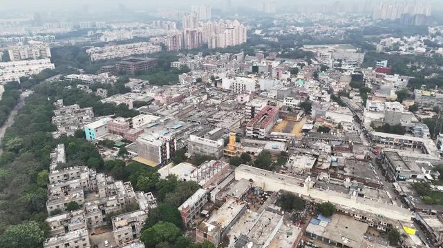 High-angle aerial of a mandir surrounded by crowded rooftops and busy lanes in Greater Noida, reflecting the city&rsquo;s grassroots spirituality within a fast-expanding urban landscape.