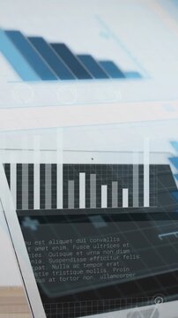 Vertical video: Blue bars appearing laptop rotating into view screen cycling charts showing data
