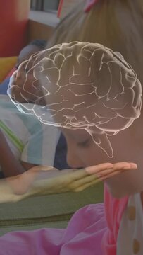 Vertical video: Adult hand raising palm, rotating AR brain overlay for learning, children watching