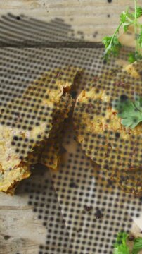 Vertical video: Two patties revealing crumb as halftone shifting, showcasing rustic paper texture