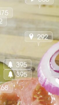 Vertical video: Alerts causing bubbles drifting over board showing tomato and pickle gaining likes