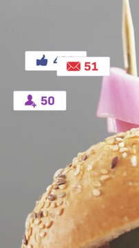 Vertical video: UI badges popping, slider entering, zooming, revealing onion and cheese, promoting