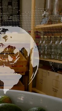 Vertical video: On play dotted globe rotating, drifting right, revealing shelves and limes below