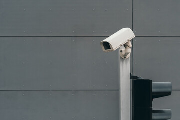 Outdoor closed-circuit television camera mounted on a traffic light pole