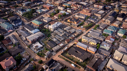 lush green vegetation scattered in-between urban civilization. © Ariyo