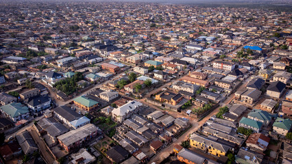 lush green vegetation scattered in-between urban civilization. © Ariyo
