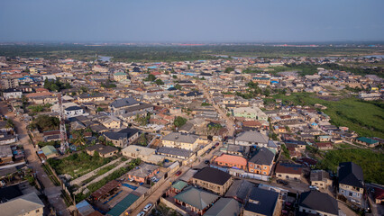 lush green vegetation scattered in-between urban civilization. © Ariyo