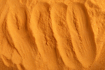 Finely milled turmeric powder forms a flowing, wave-like surface in a deep golden hue, evoking natural sources, tradition, and wellness. Its... © Contentino