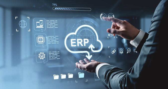 Businessman using virtual ERP interface with cloud computing icons on digital futuristic background for enterprise resource planning concept.