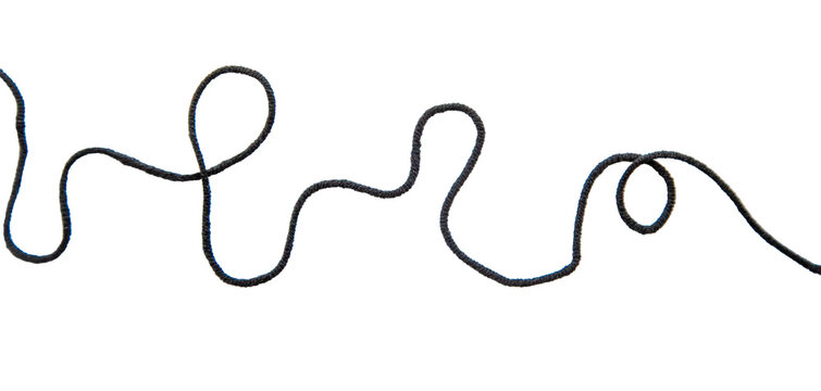 Black thread isolate on white background. Selective focus. Old.