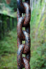 Fototapeta premium Strong industrial black chain with weathered rusty details.