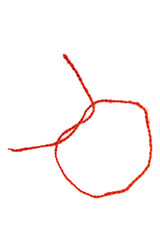 Red thread isolate on white background. Selective focus. Old.