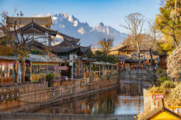 Lijiang Old Town with Jade Dragon Snow Mountain in Yunnan, China © Nicholisa