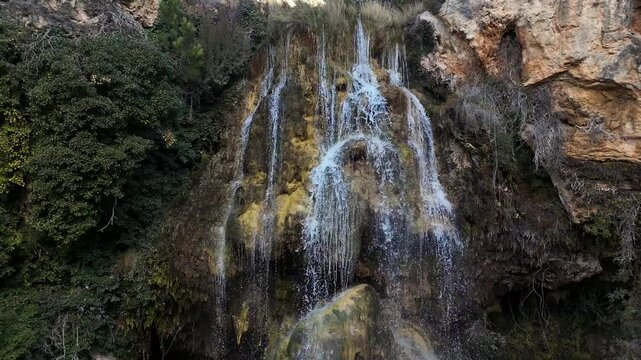 Spectacular drone view of the Hiedra waterfall in Mora de Rubielos, Teruel, Aragon