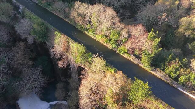 Aerial View Of Ponte Peon - Historic Stone Aqueduct Above San Crimenzo River In Dumbria, Spain. rotating shot