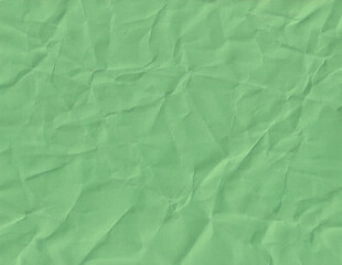 Obraz premium Texture of crumpled paper in green color creates an interesting background for various designs or artistic projects