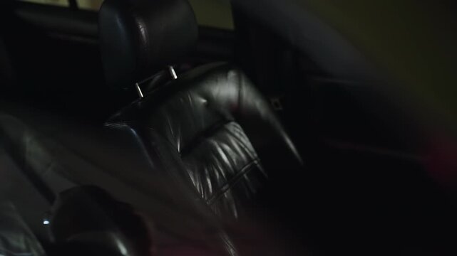 Side airbag inflating in slow motion during a car crash simulation test, deploying from the seat to protect a passenger from injury in a dangerous traffic accident and saving a life