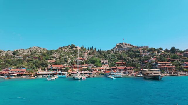 Kalekoy, Demre, Turkey - June 14, 2025: Simena Castle is an ancient Lycian fortress in Kalekoy village of the Demre district in the Antalya Province of Turkey.