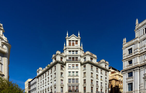 Historic Edificio Olmedo at Puerta Real Granada Spain with Neo Baroque Architecture and Early 20th Century Regionalist Design under Clear Blue Sky