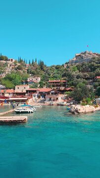 Kalekoy, Demre, Turkey - June 14, 2025: Simena Castle is an ancient Lycian fortress in Kalekoy village of the Demre district in the Antalya Province of Turkey.