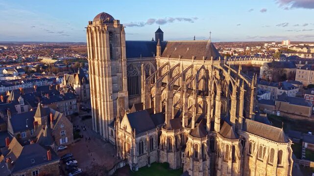 Aerial drone view of the apse and roof of the historic Saint Julien Cathedral during a beautiful sunset, Le Mans in France