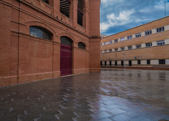 Historic Facade of M&aacute;laga Bullring with Arched Details