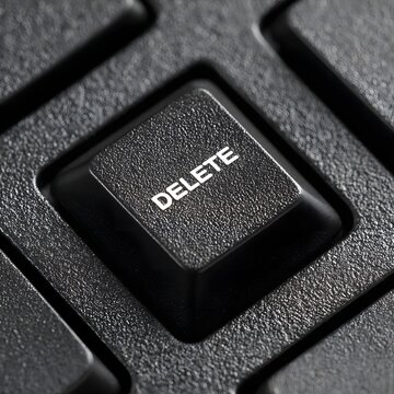 Close-Up Image of a Keyboard Delete Key on a Black Background