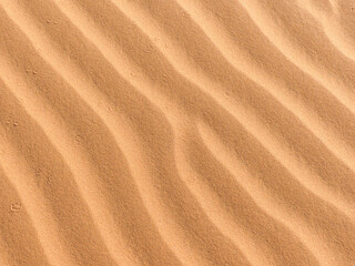 Obraz premium Desert sand ripples and patterns, abstract natural texture background